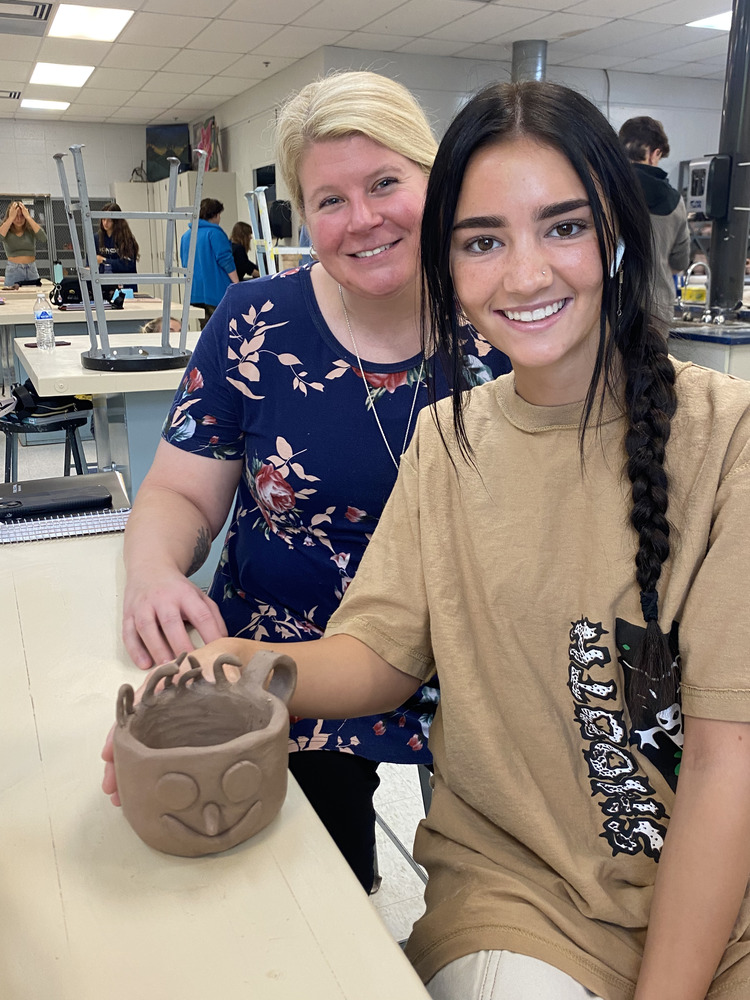 LHS Teacher and student in pottery class