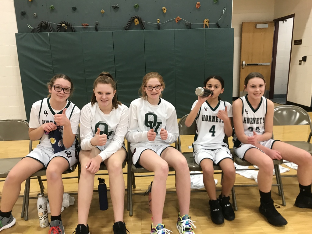 girls basketball team on bench