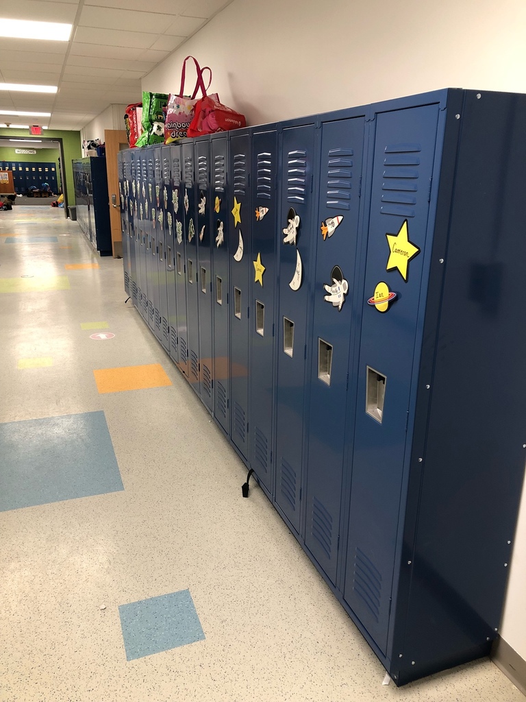 blue metal lockers in school hallway