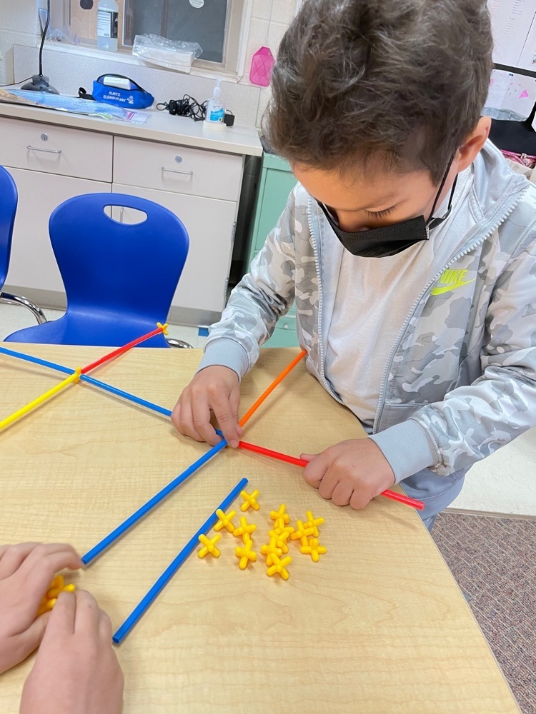 students building with tubes and connectors