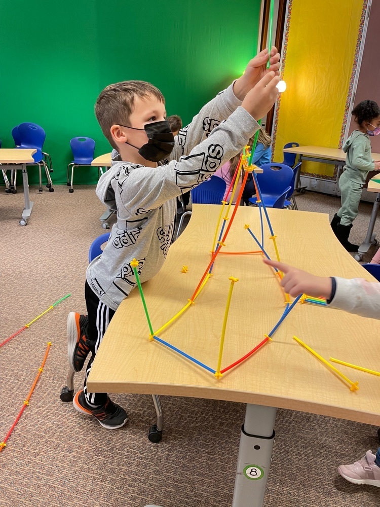 students building with tubes and connectors