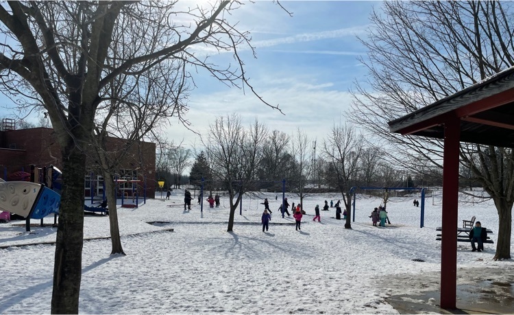 students playing outside in recess in the snow