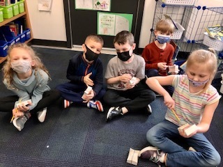 First Graders in Mrs. Currie's class investigated sounds and vibrations in science. 