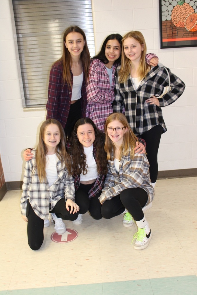 six girls with plaid shirts