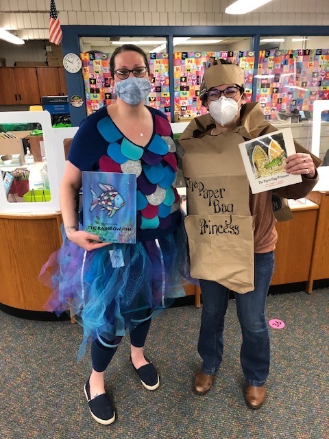 woman dressed up as the rainbow fish and another woman dressed up as the paper bag princess