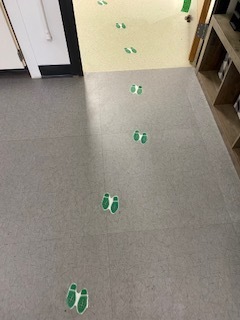 green footprints on the floor