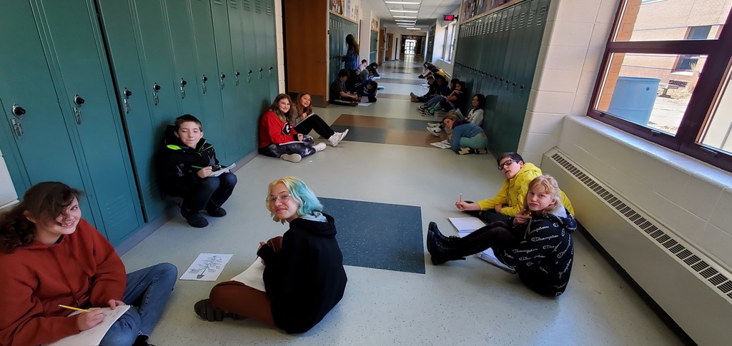 Students in the hallway playing a math game