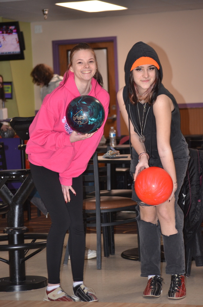 students holding bowling balls