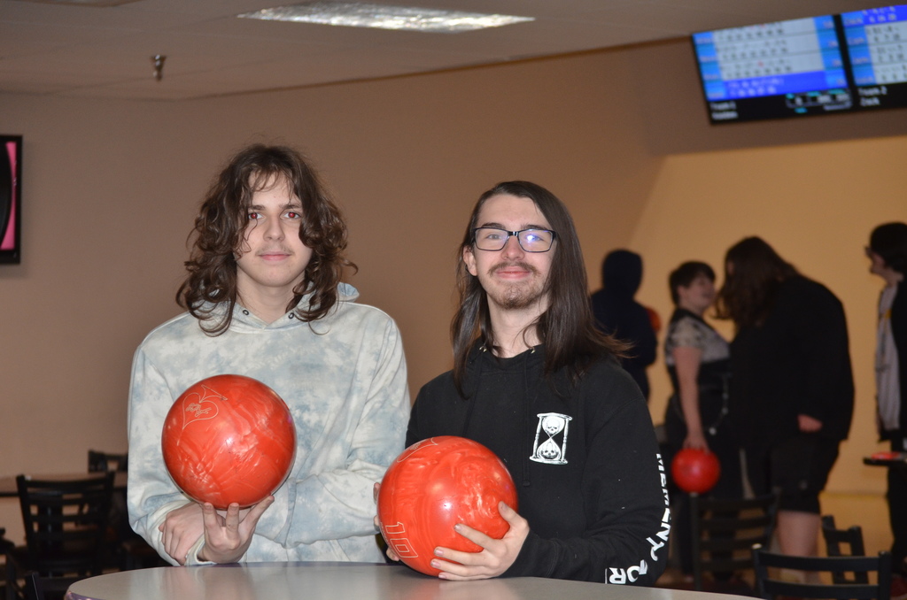 students holding bowling balls