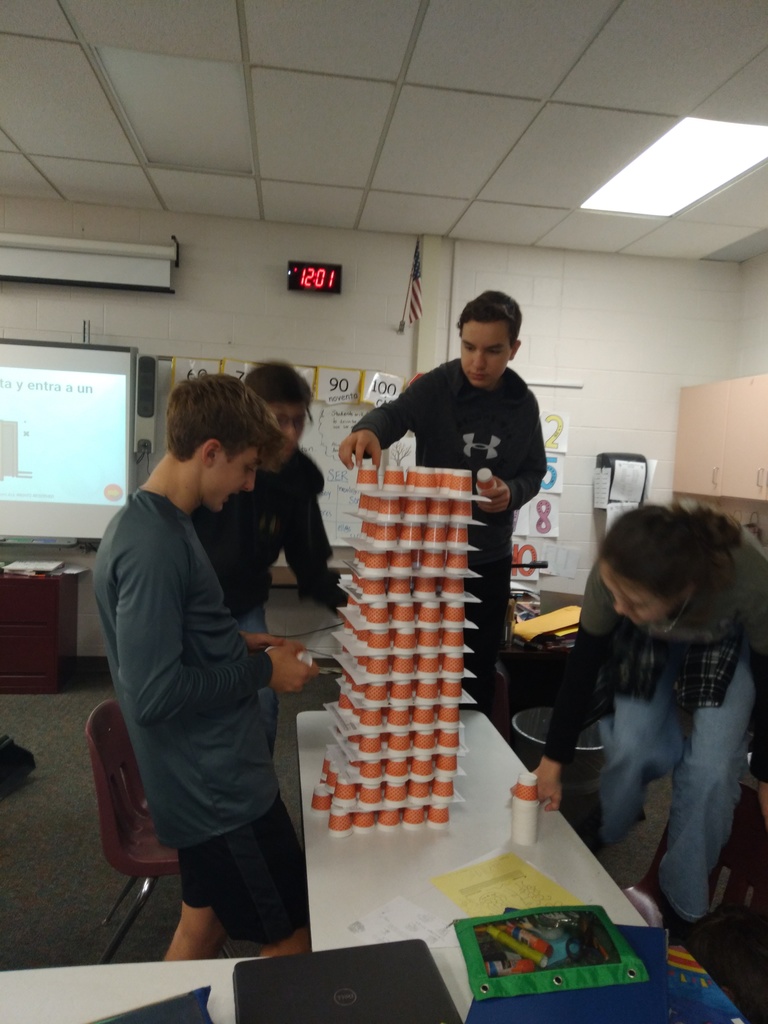 students building tower of cups