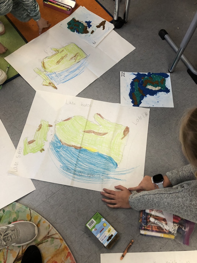students creating 3D maps with clay