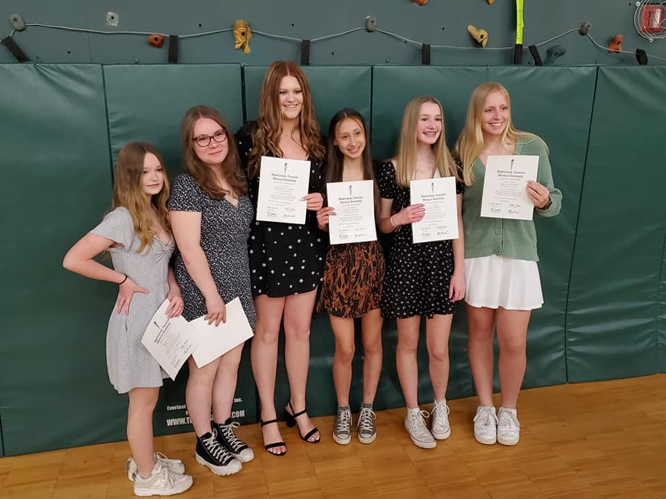 Girls holding NJHS certificates