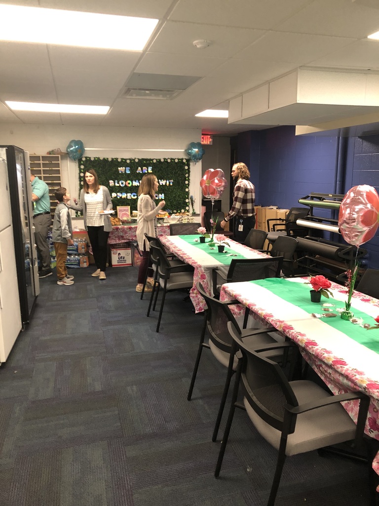 teachers in staff lounge with food and decorations