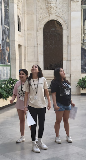 three girls looking at murals in DIA