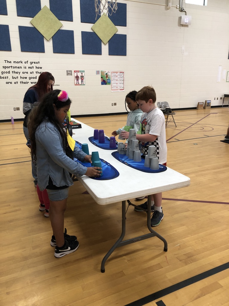 students doing cup stacking challenge