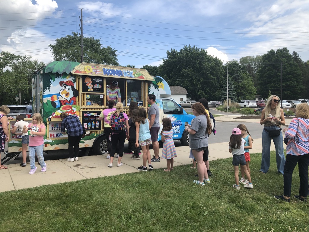children and parents in line for shaved ice truck