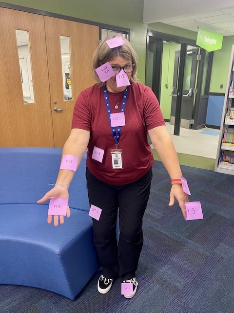 teacher covered in sticky notes