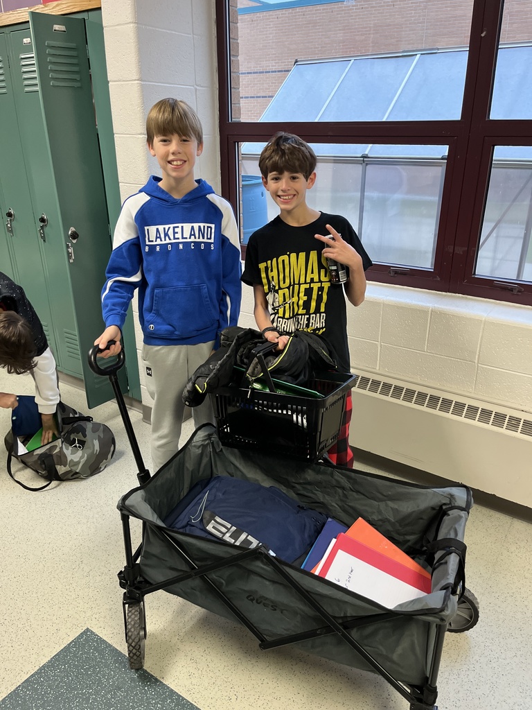 two boys with wagons for backpacks