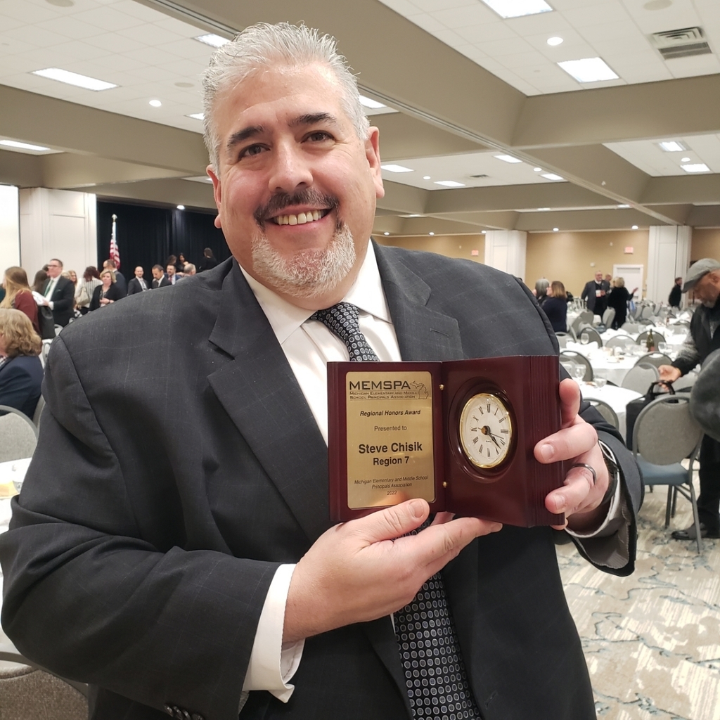 Steve Chisik holding award