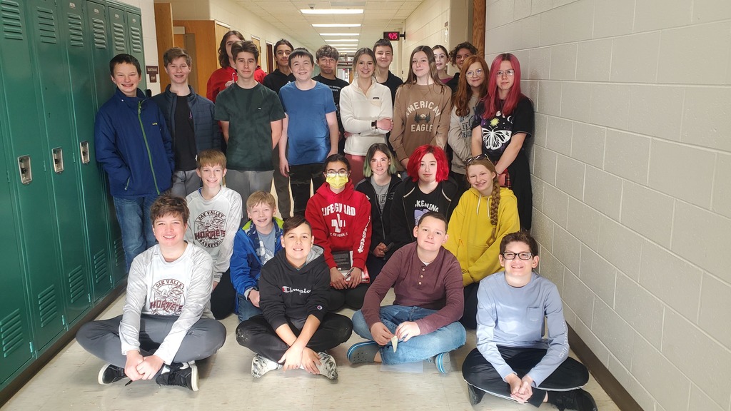 band members pose in hallway