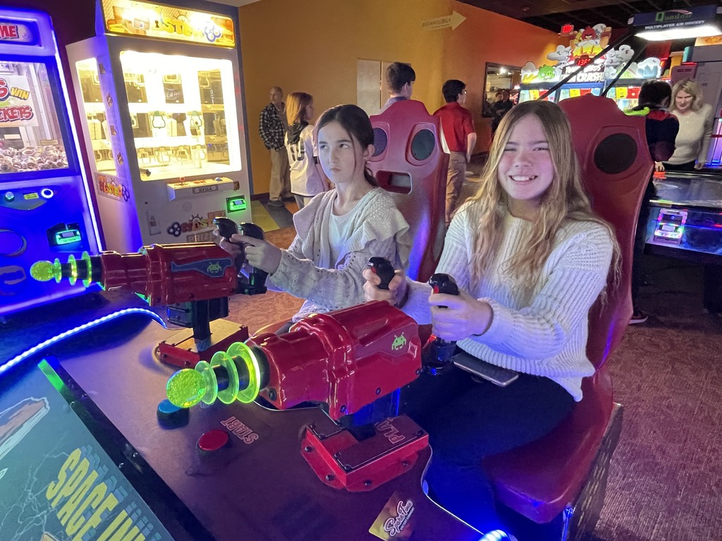 students playing arcade games