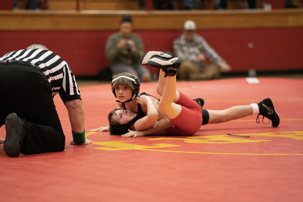 one wrestler pins another